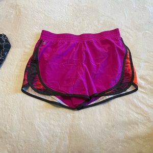 Tek Gear running short pink orange and purple size medium gently used.